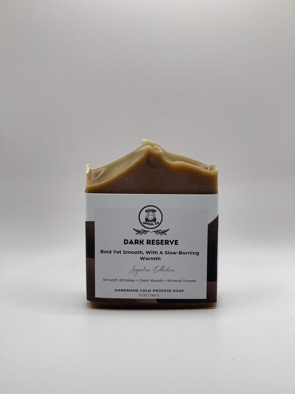 Bar of soap with a white label on a gray background