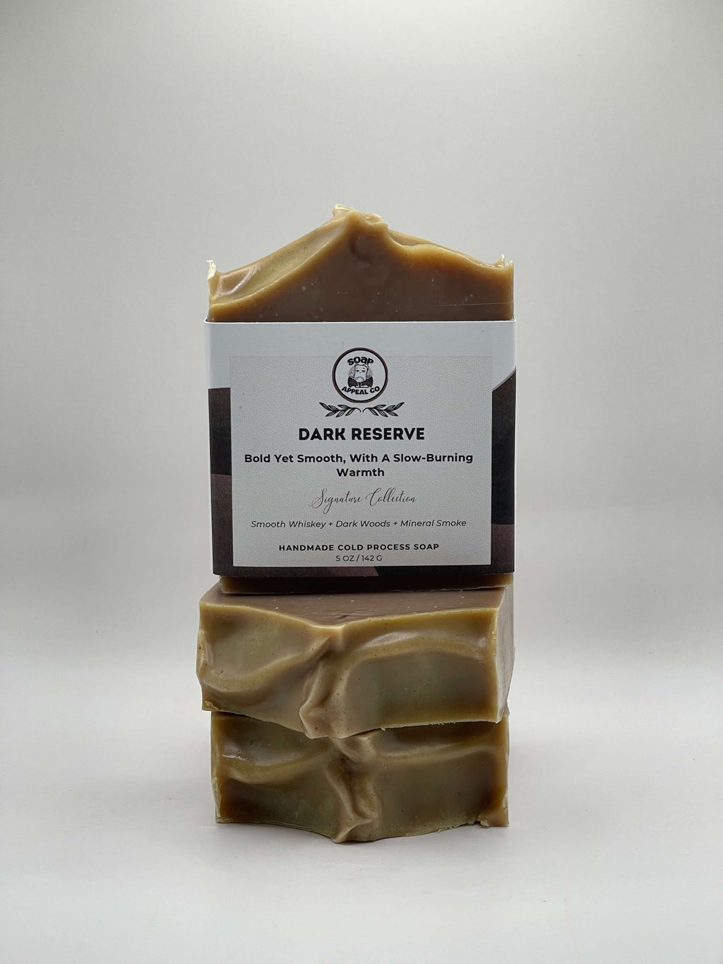 3 bars of soap with a label on a gray background