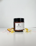 Jar of body polish scrub with a label on a white background