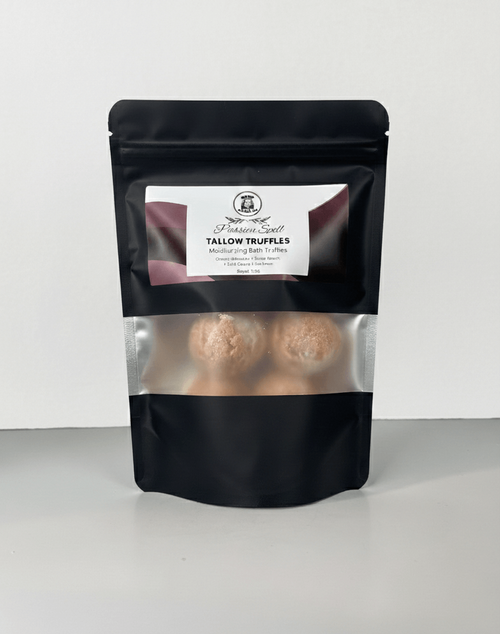 Black packaging of tallow truffles with a white label on a white background