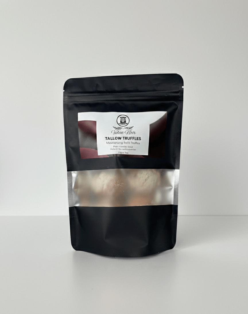 Black packaging of tallow truffles with a visible brand label on a white background