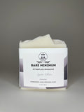Bar of soap with a 'Bare Minimum' label on a gray background
