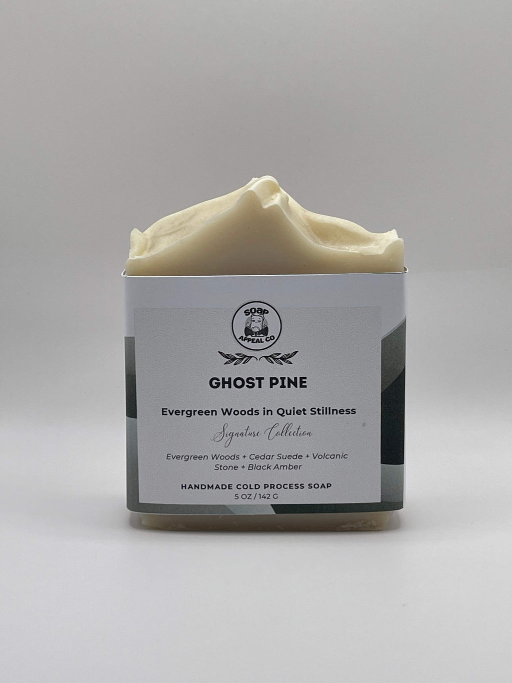 Bar of soap with a label on a gray background