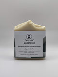 Bar of soap with a label on a gray background