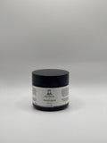 Small jar of tallow magnesium lavender cream on a white background