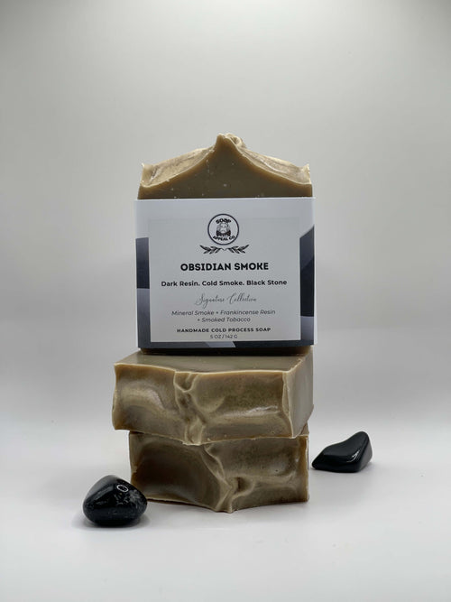 3 bars of grey soap with a label on a white background