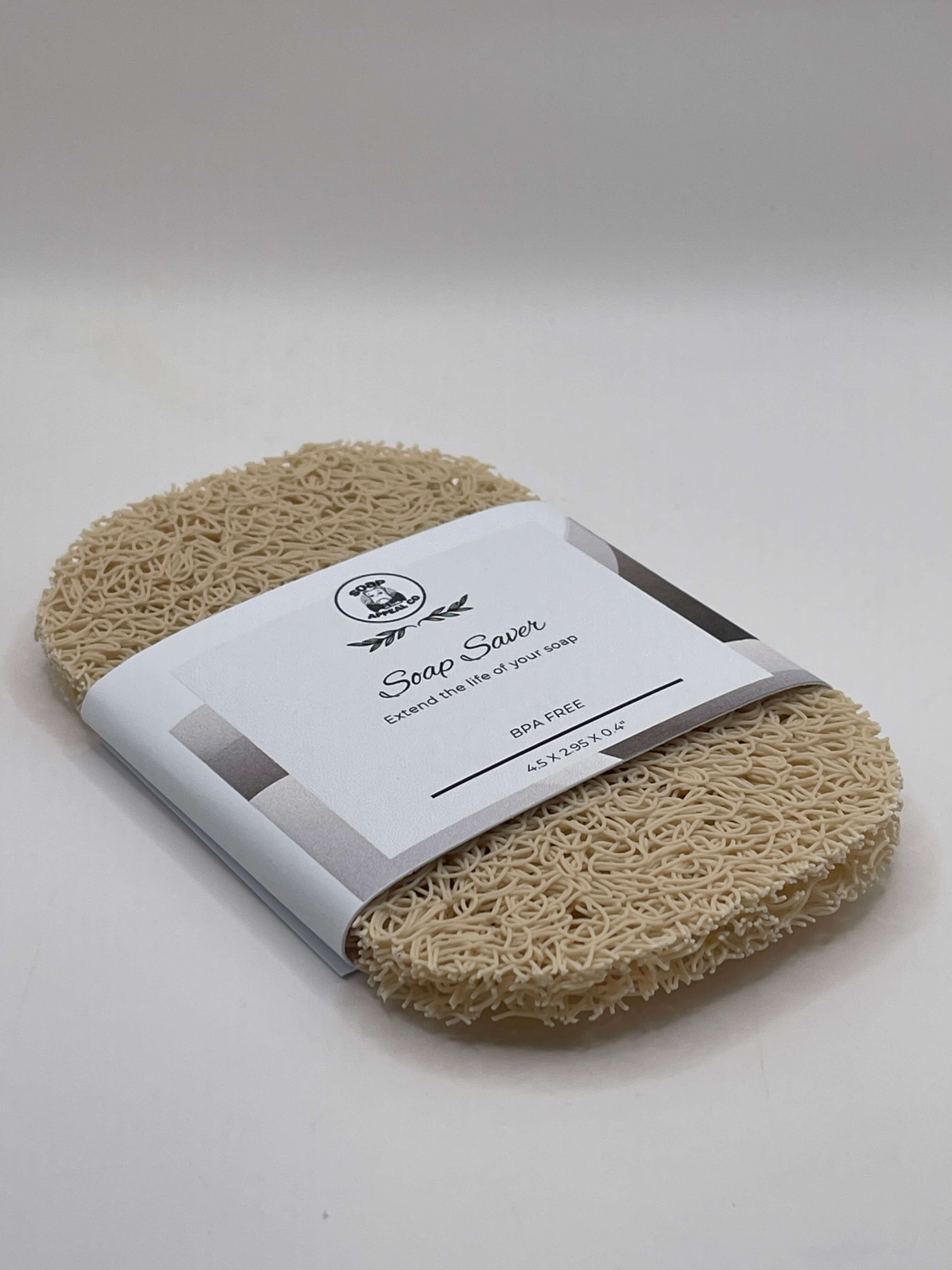 Beige natural soap saver with a label on a white background